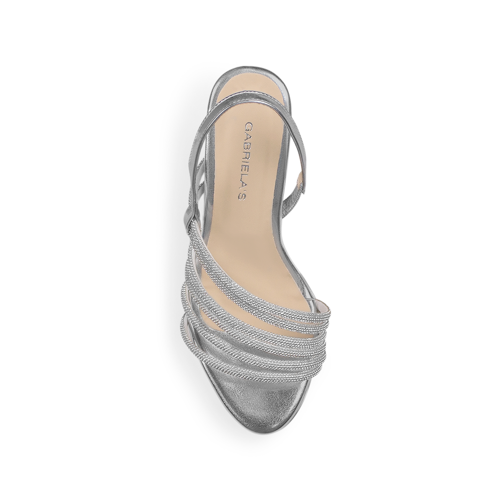 Vista superior de zapatilla plata para mujer con correa trasera y tiras de pedrería