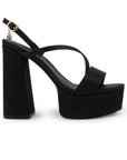 Vista lateral de zapatilla negra para mujer con plataforma al frente con colgante brillante tiras delgadas y tacón alto de 14cm