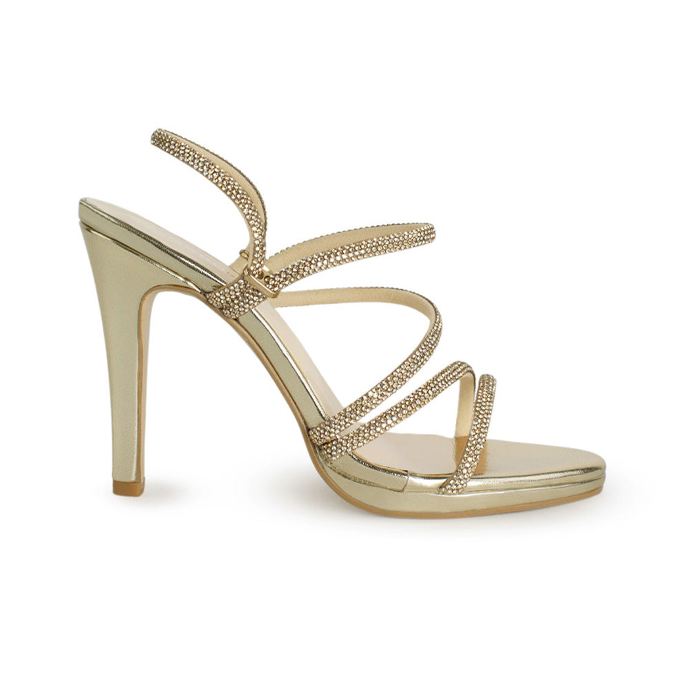 Vista lateral de zapatilla oro para mujer con pedrería brillante y tacón medio de 10cm