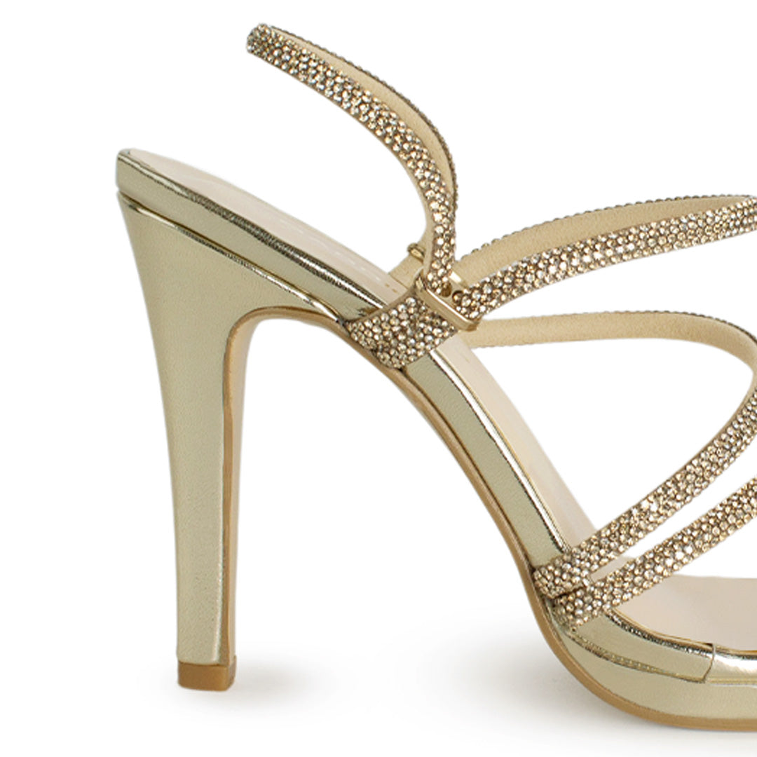 Vista trasera de tacón medio de 10cm en zapatilla con pedreria brillante para mujer en color oro