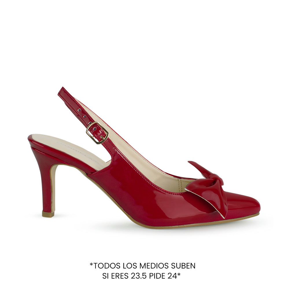Vista superior de zapatilla roja destalonada para mujer con un moño en punta fina cerrada y tacón delgado de 8cm tipo stiletto 