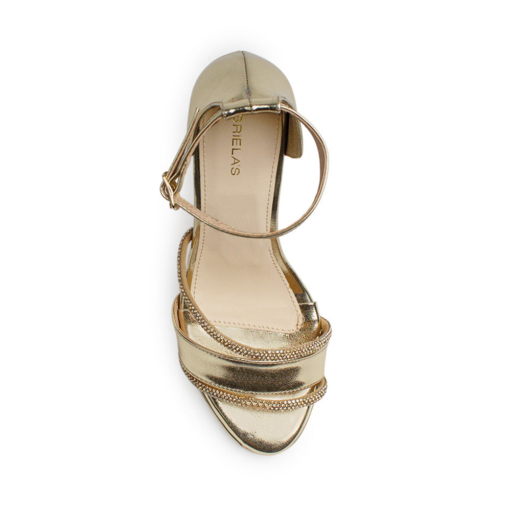 vista superior de zapatillas de fiesta doradas para dama con tiras de pedrería y tacón medio 10 cm  