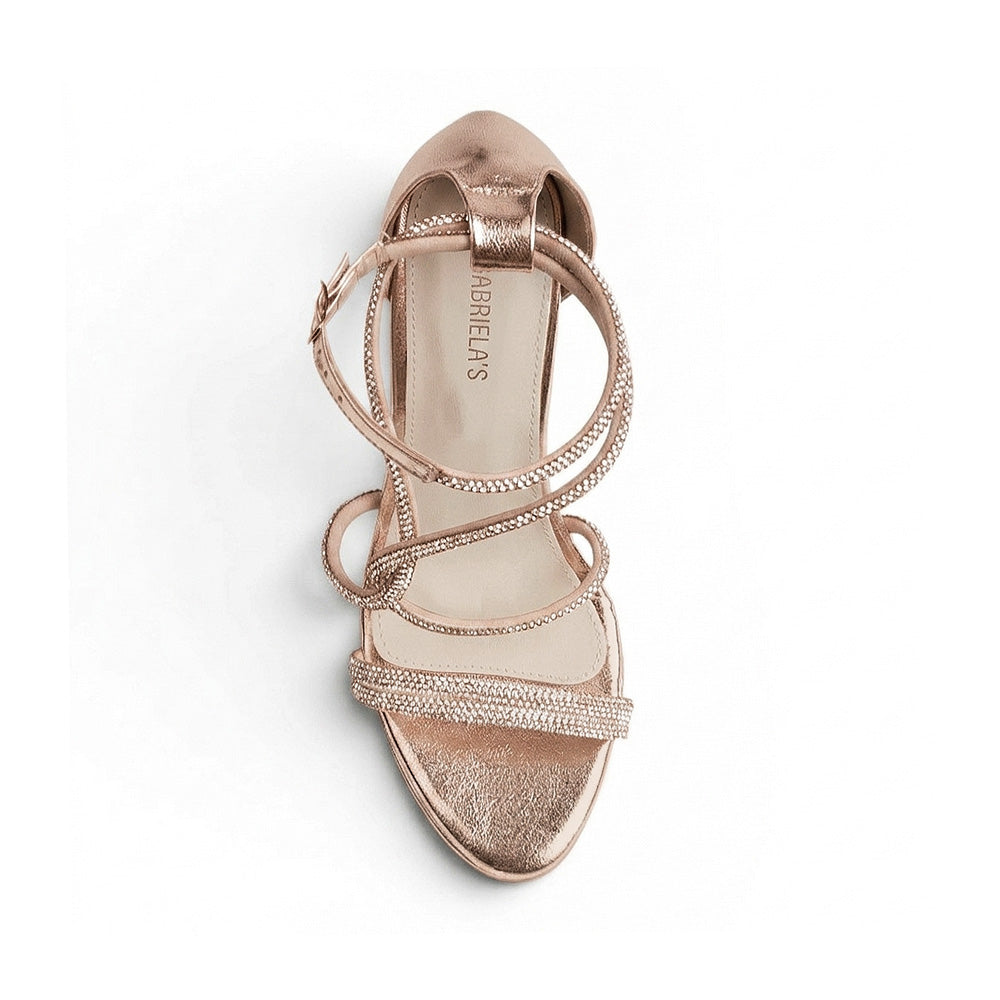 Vista superior de zapatilla oro rosa de diseño descubierto para mujer con tiras de pedrería y pulsera ajustable