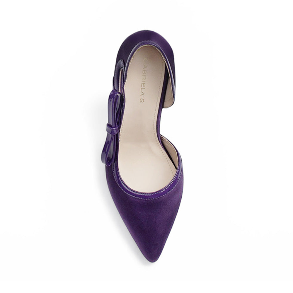 Vista superior de zapatilla morada para mujer con punta fina y moño lateral tipo stiletto