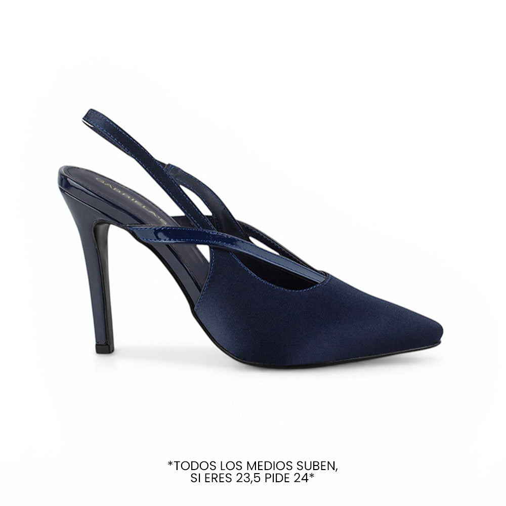 Vista diagonal de zapatilla azul para mujer con tiras cruzadas destalonada y tacón alto de 11cm