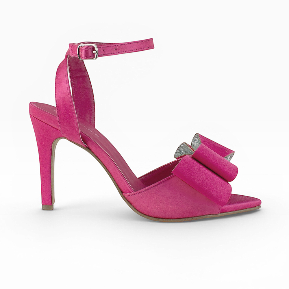 Vista lateral de zapatilla rosa para mujer con moño pulsera ajustable al tobillo y tacón delgado medio de 10cm