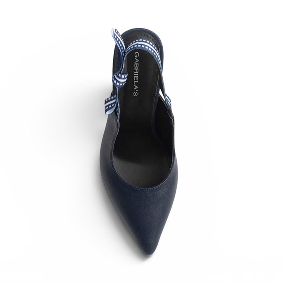 Vista superior de zapatilla azul destalonada para mujer tipo stiletto con punta fina cerrada y nudo lateral 