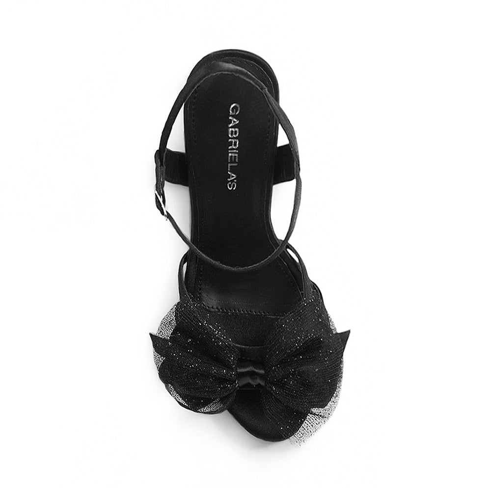 vista superior de zapatillas negras de fiesta con moño brilloso para dama y tacon alto 11cm 
