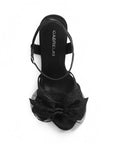 vista superior de zapatillas negras de fiesta con moño brilloso para dama y tacon alto 11cm 