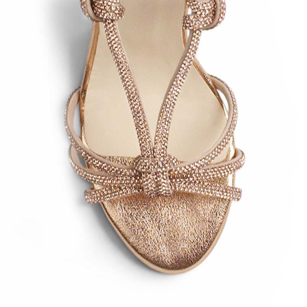 vista del detalle en tiras cruzadas con brillos de las zapatillas oro rosado y tacón alto 11cm para dama 