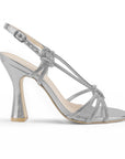 vista lateral de zapatillas plata para dama con tiras cruzadas y tacón alto 11cm