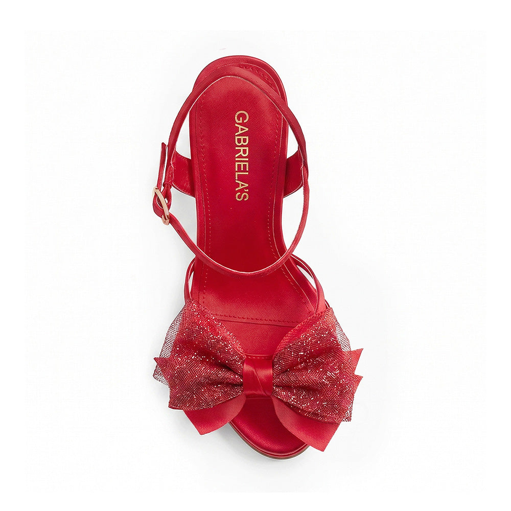 vista superior de zapatillas rojas con ajuste al tobillo moño y tacón alto 11cm para dama 