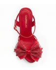 vista superior de zapatillas rojas con ajuste al tobillo moño y tacón alto 11cm para dama 