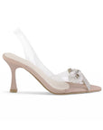 vista lateral de zapatillas nude destalonadas con moño de pedrería plateado y tacón medio 9 cm para dama 