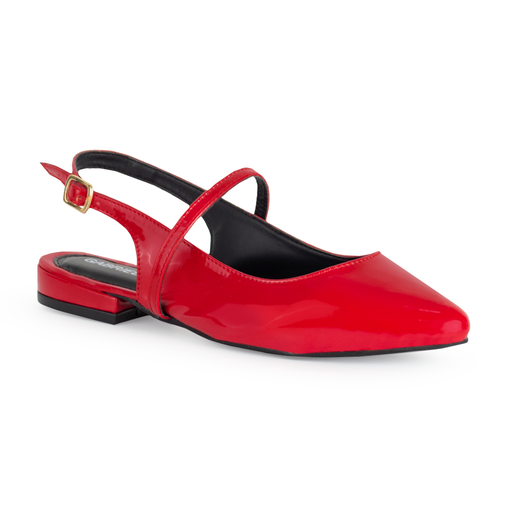 vista lateral de zapatillas rojas de charol para dama con tiras cruzadas