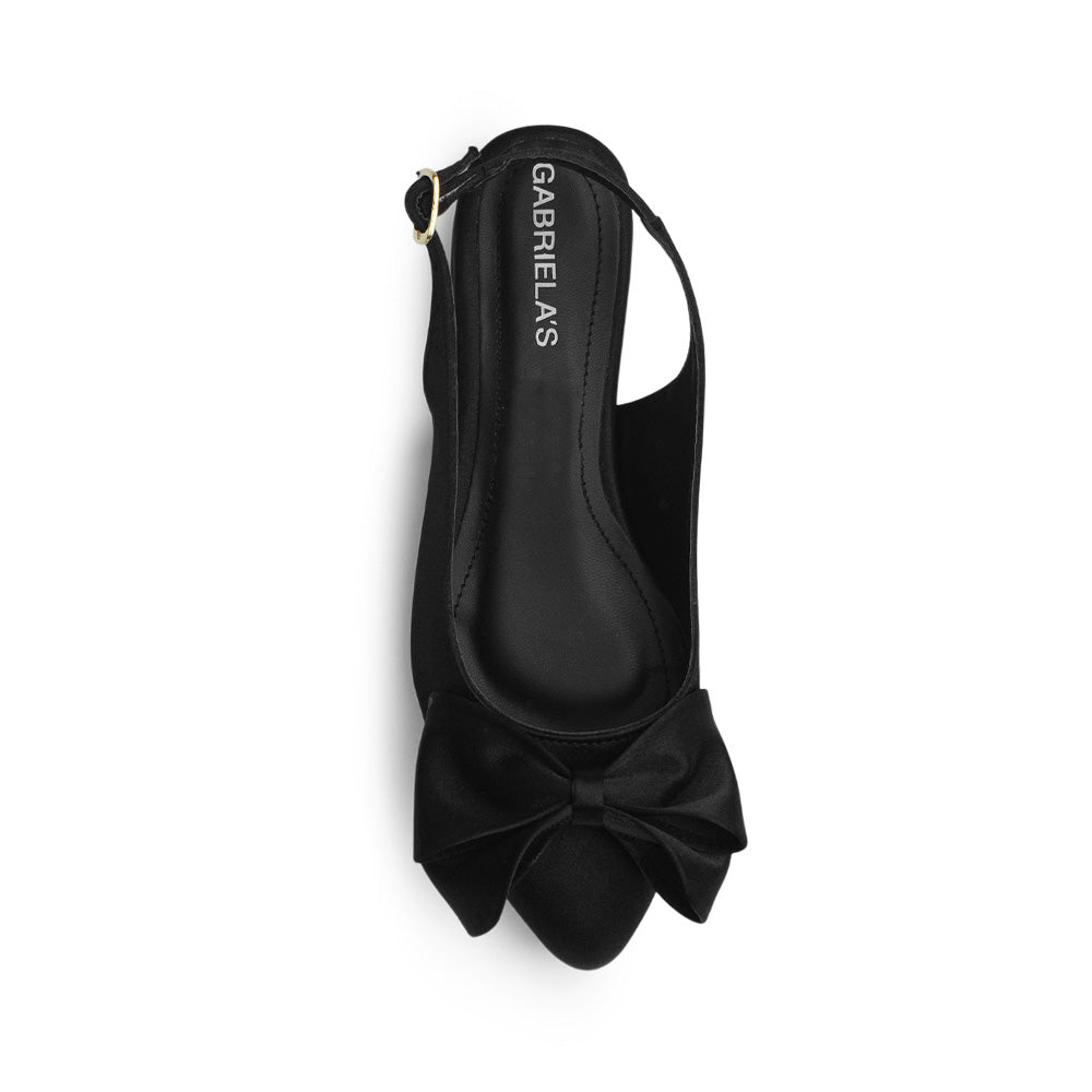 Vista superior de flats negros para mujer en punta fina con moño y silueta destalonada con correa ajustable
