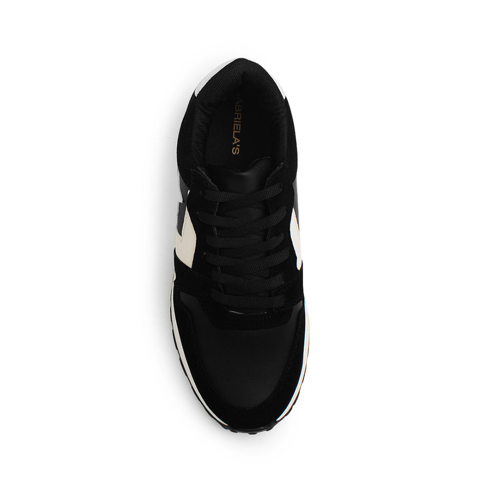 Vista superior de tenis negro para mujer con agujetas y estrellas decorativas 