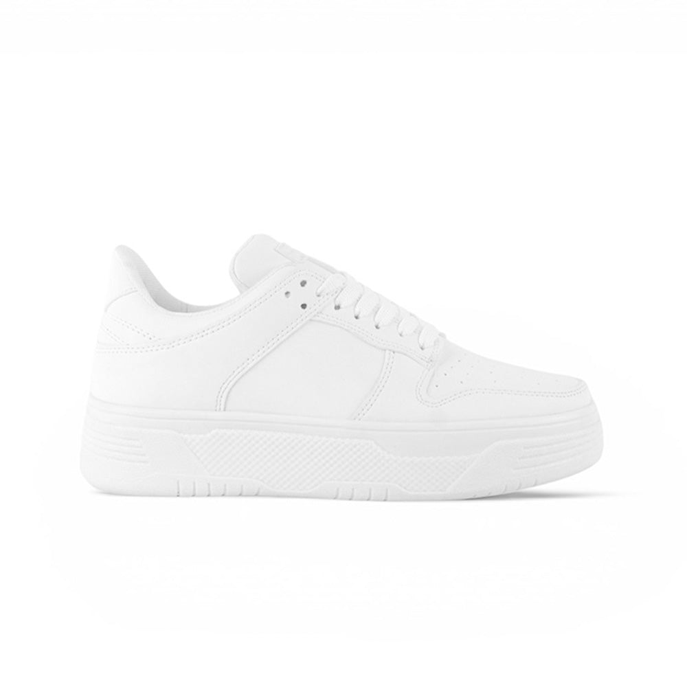 vista lateral de tenis blancos para dama con plataforma gruesa