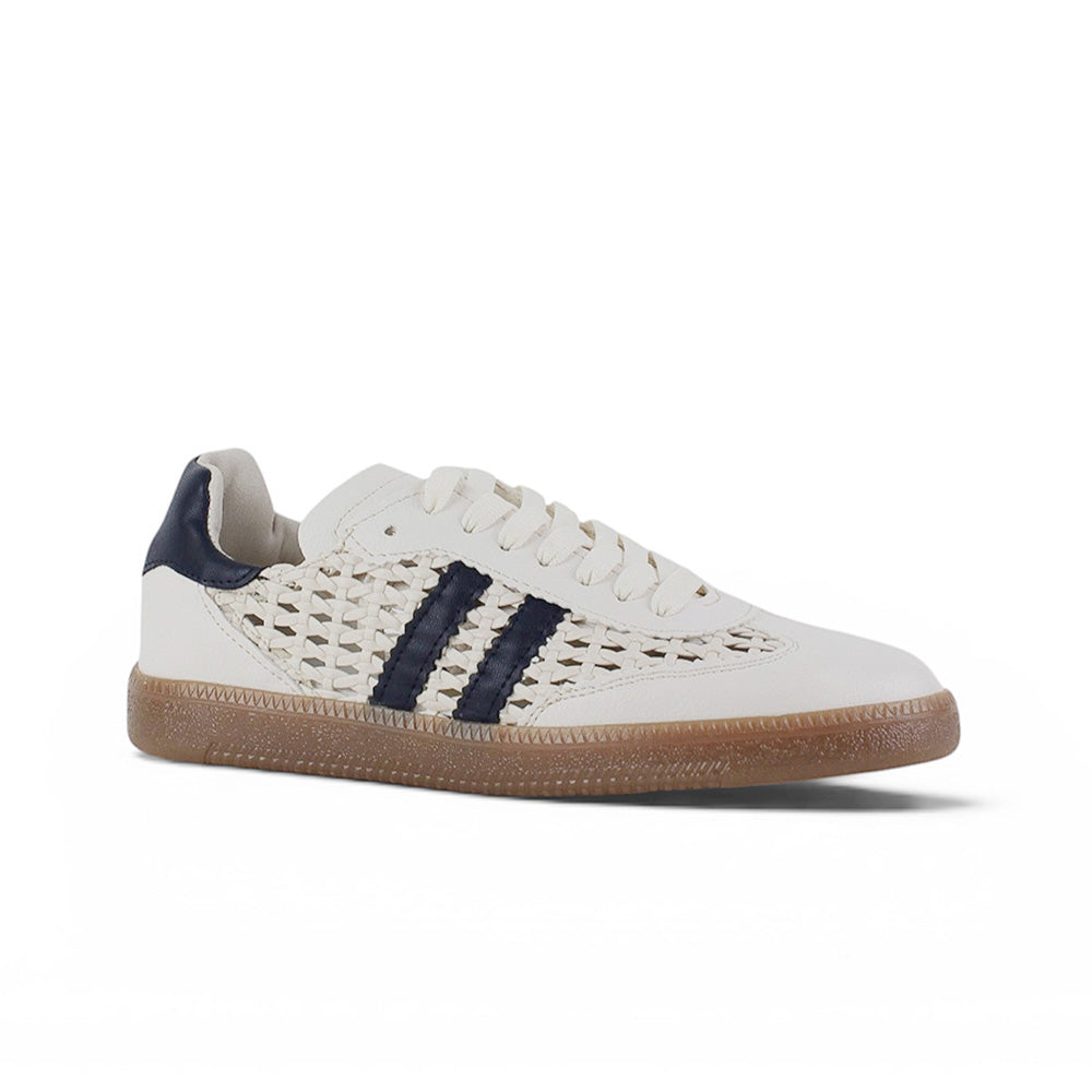 Vista diagonal de tenis beige con azul y detalles tejidos para dama de piso 