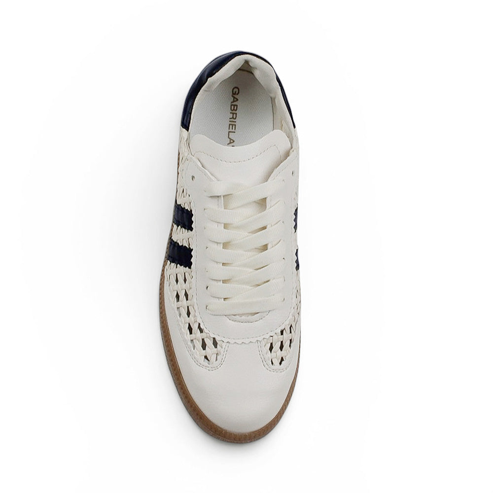 Vista superior del tenis beige con azul para dama de piso y detalles tejidos 
