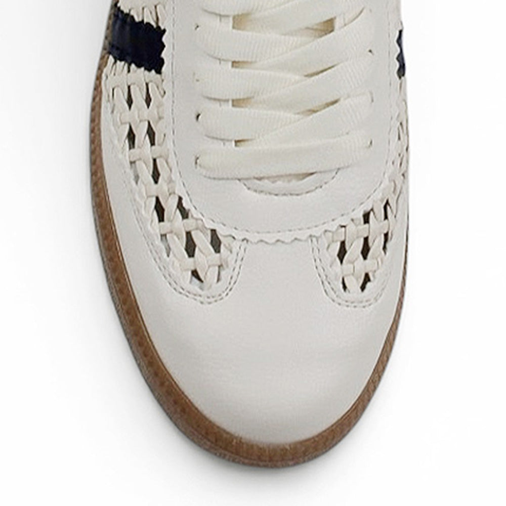 Vista del detalle tejido del tenis beige con azul para dama de piso