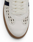 Vista del detalle tejido del tenis beige con azul para dama de piso