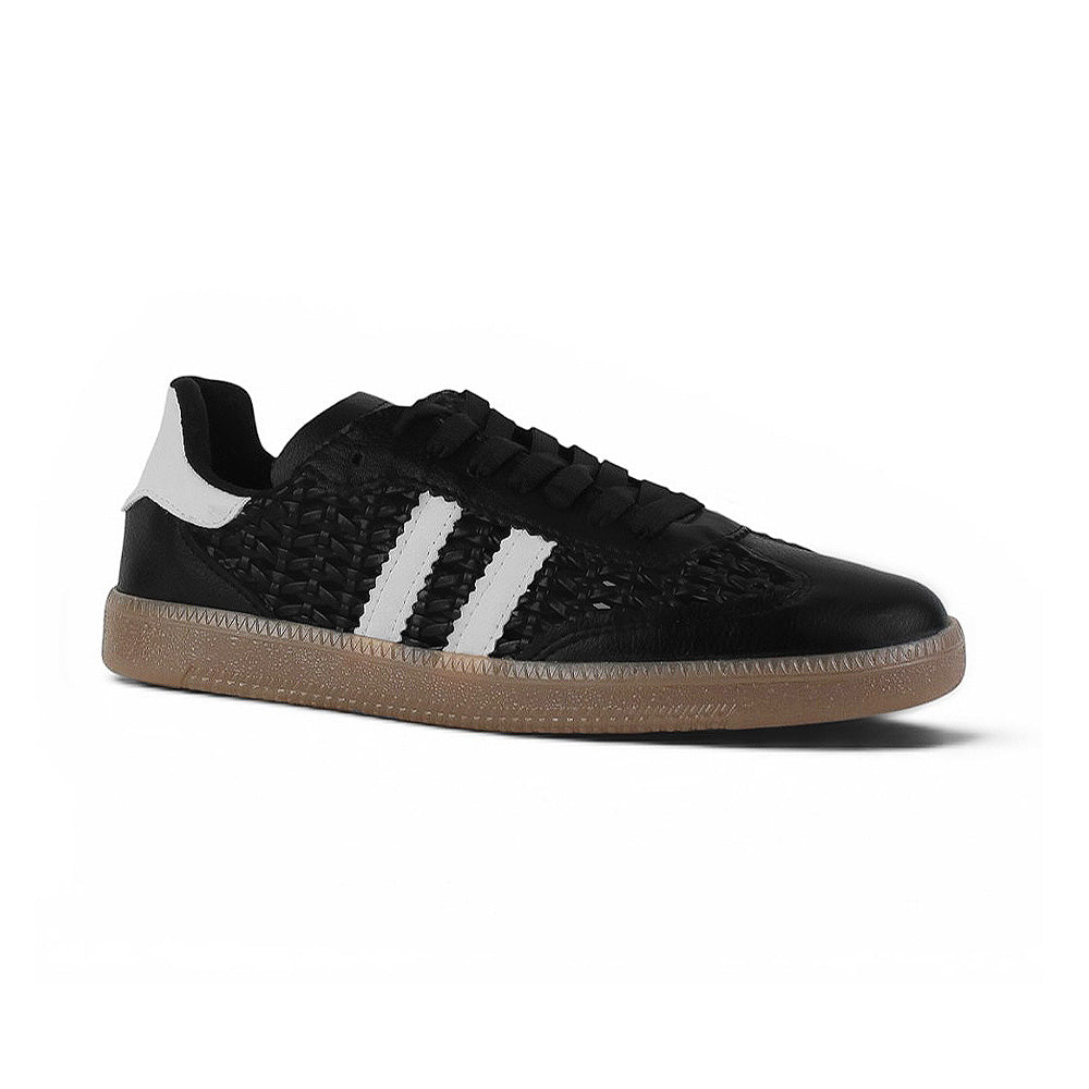 Vista diagonal de tenis negro con blanco y detalles tejidos para dama de piso 