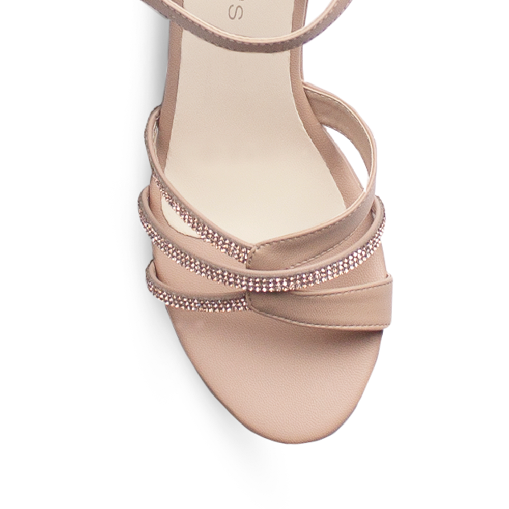 Vista de material cabra sintético en zapatilla nude de plataforma para mujer con tiras de pedrería tacón ancho de 10cm y pulsera ajustable 