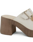 Vista trasera de tacón grueso medio de 8cm en zapatilla beige de diseño descubierto con doble correa  y hebillas ajustables cuadradas