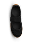 Vista superior de tenis negro con pulsera ajustable en el empeine y punta redonda para dama 