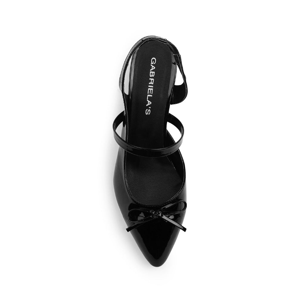Vista superior de zapatilla negra destalonada para mujer con moño en punta fina cerrada 