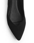 Vista de material buck en flats negros destalonados para mujer con punta fina 