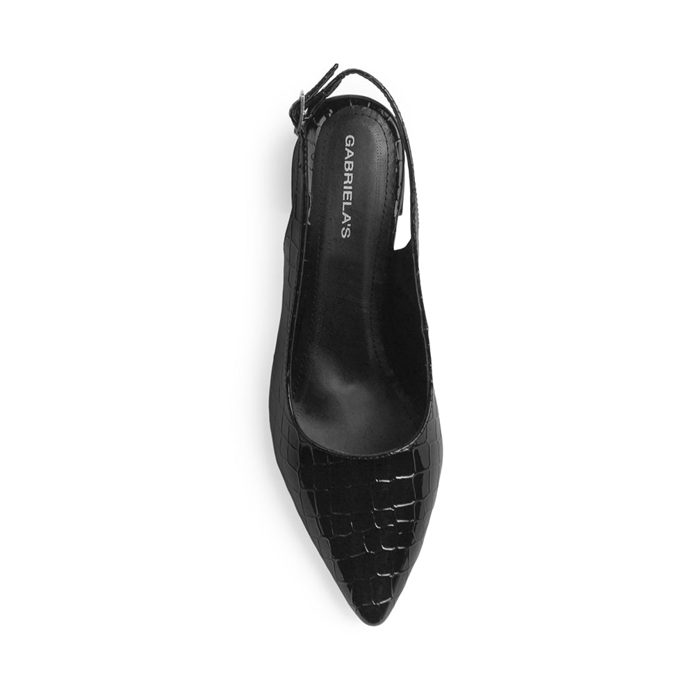 Vista superior de zapatilla negra  destalonada para mujer con pulsera ajustable y punta cerrada fina