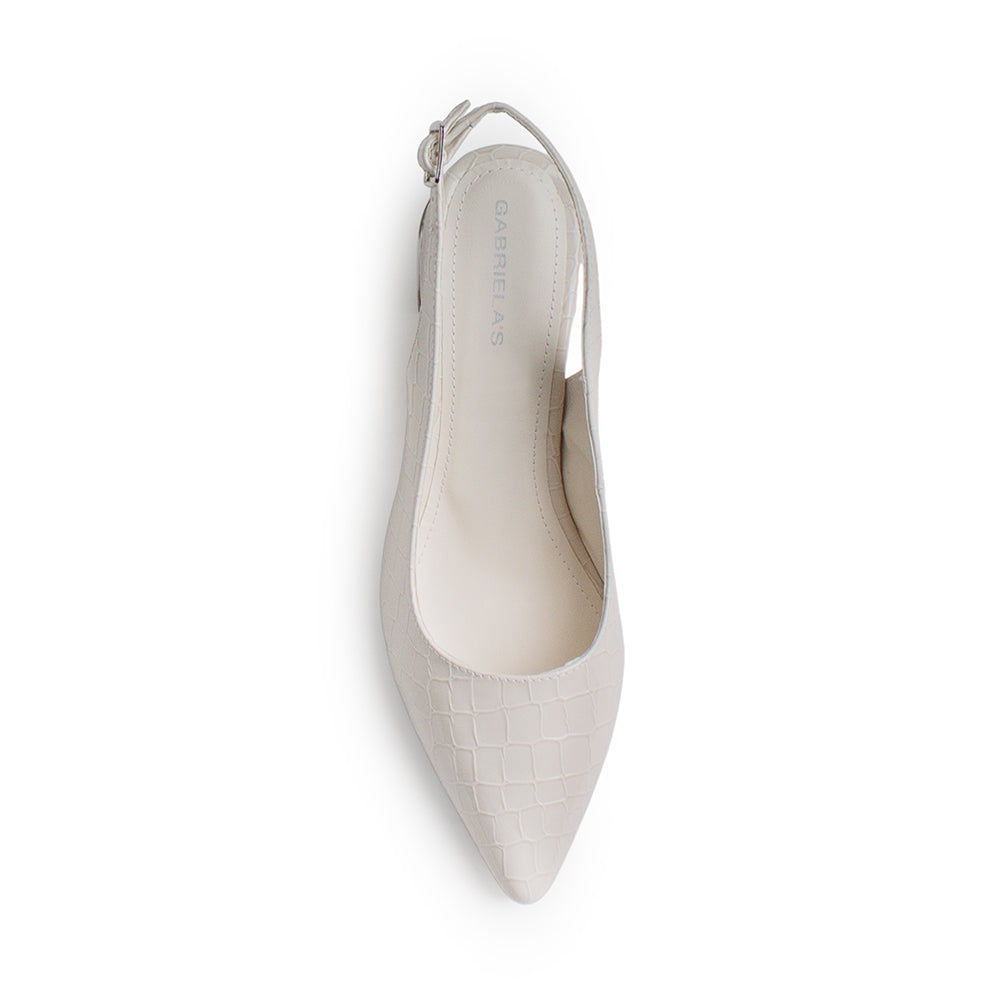 Vista superior de zapatilla beige destalonada para mujer con pulsera ajustable y punta cerrada fina