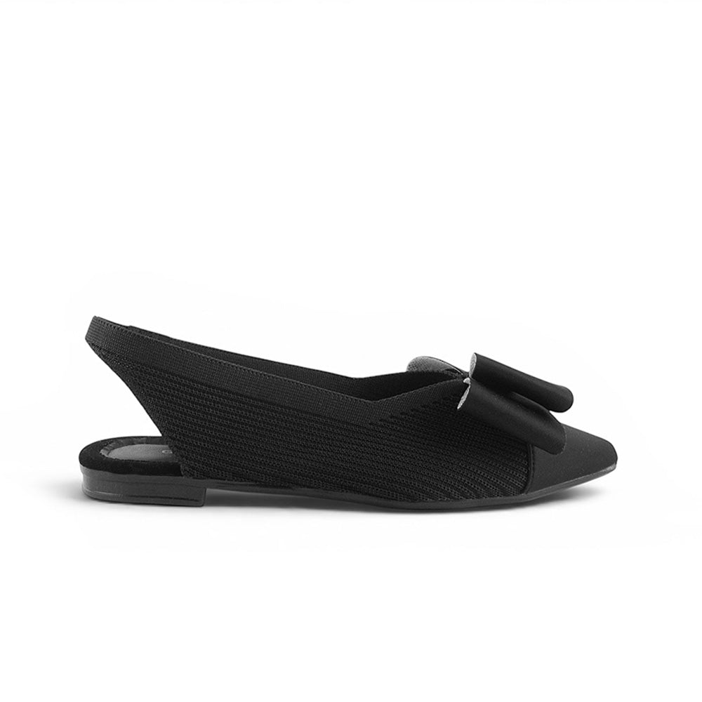 vista lateral de flats negras para mujer con moño 
