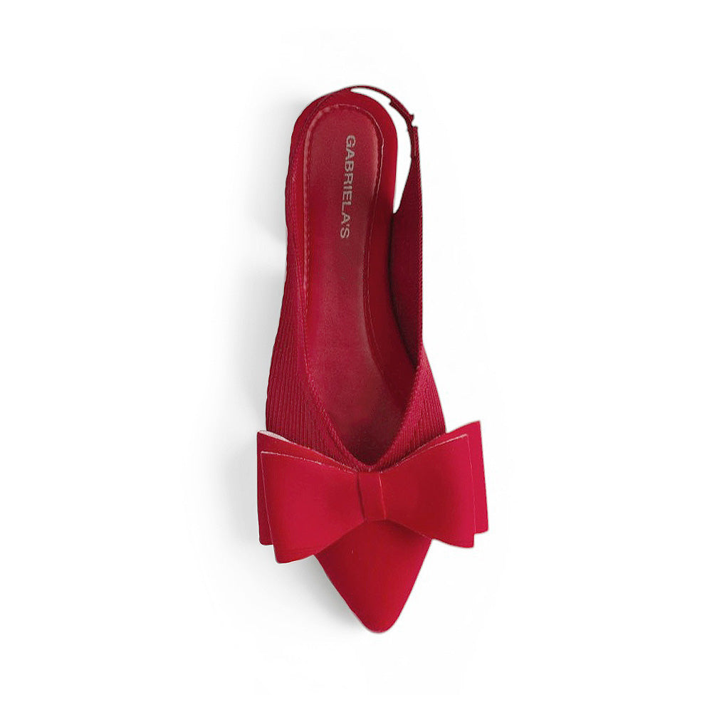 vista superior de flats rojos con moño para mujer