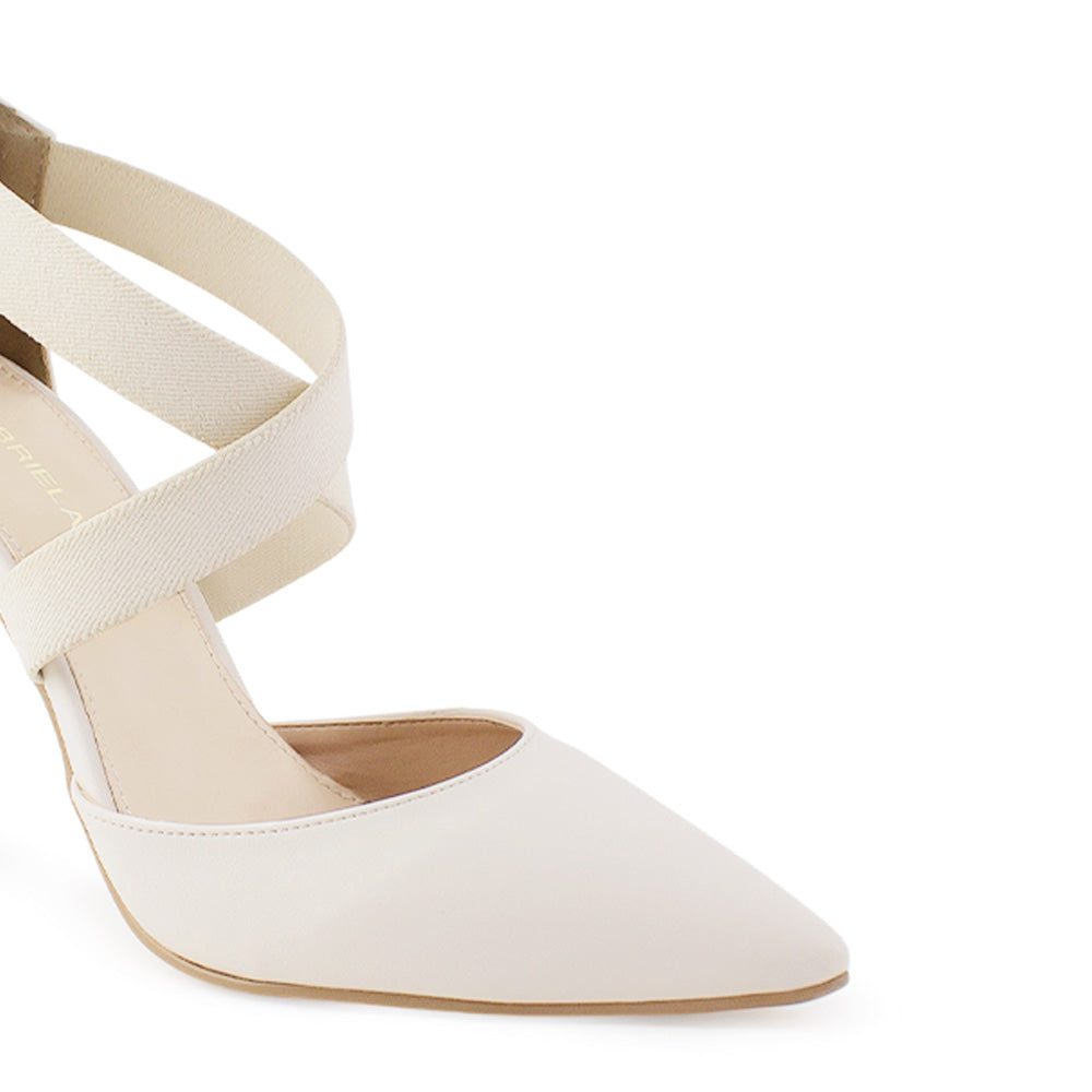 Detalle de material cabra sintetico de zapatilla beige para mujer