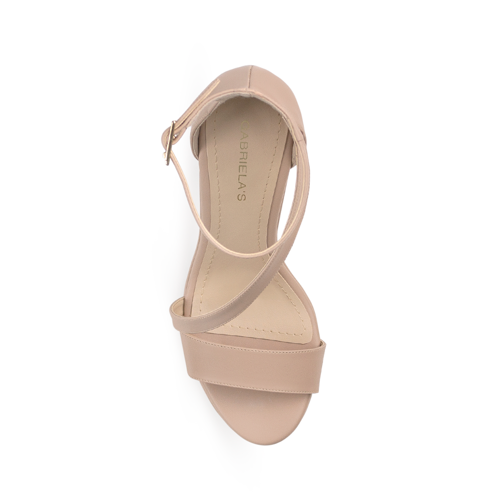 Vista superior de zapatilla maquillaje con tira cruzada para mujer