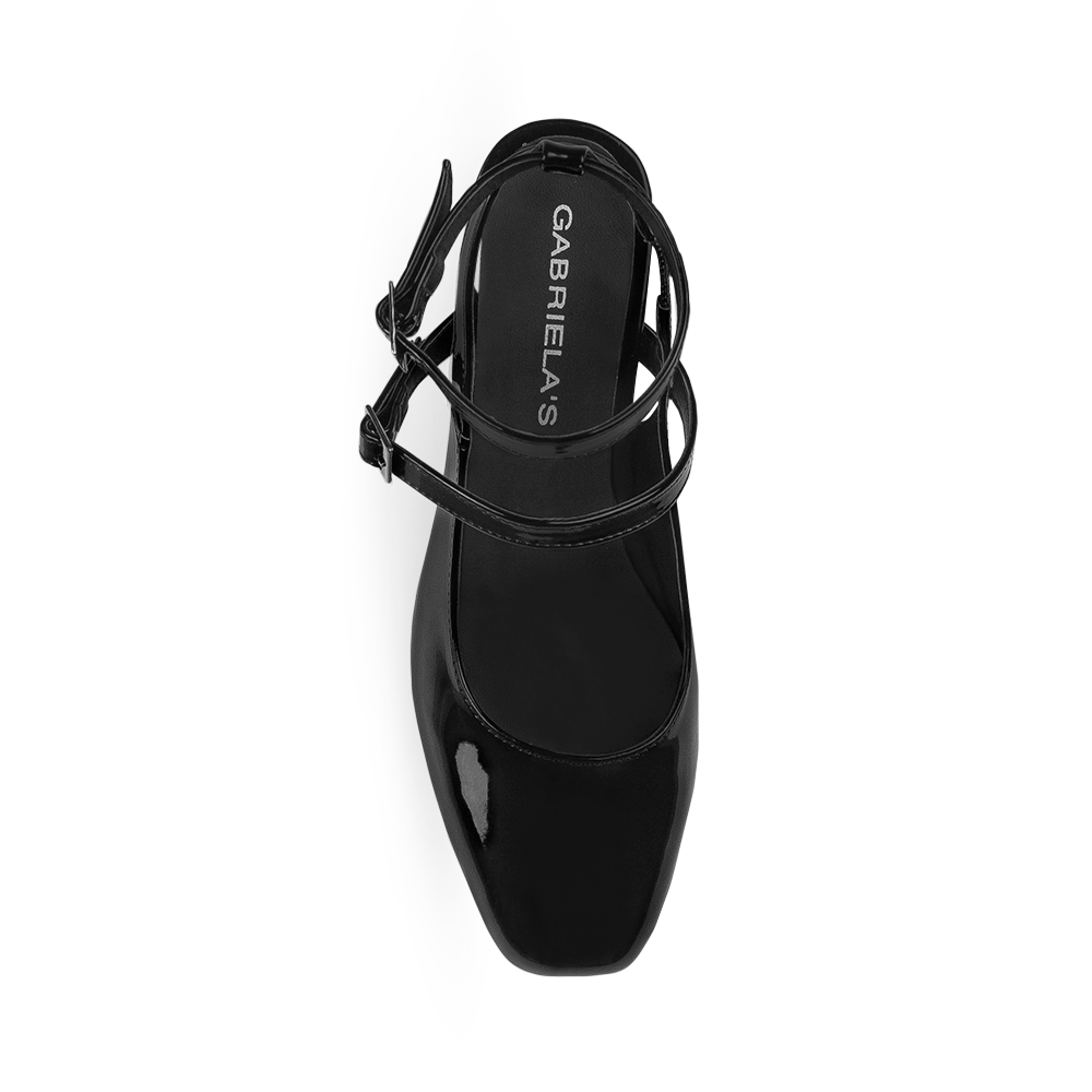 Vista superior de zapatilla con doble hebilla para mujer color negro