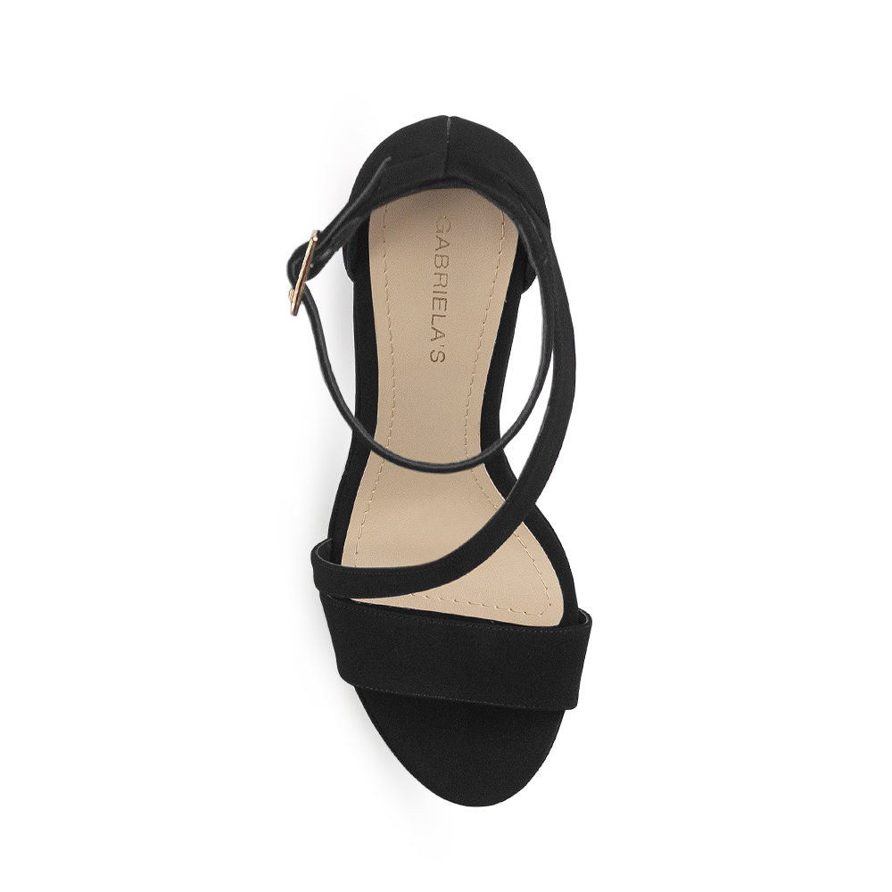 Vista superior de zapatilla negra con tira cruzada para mujer