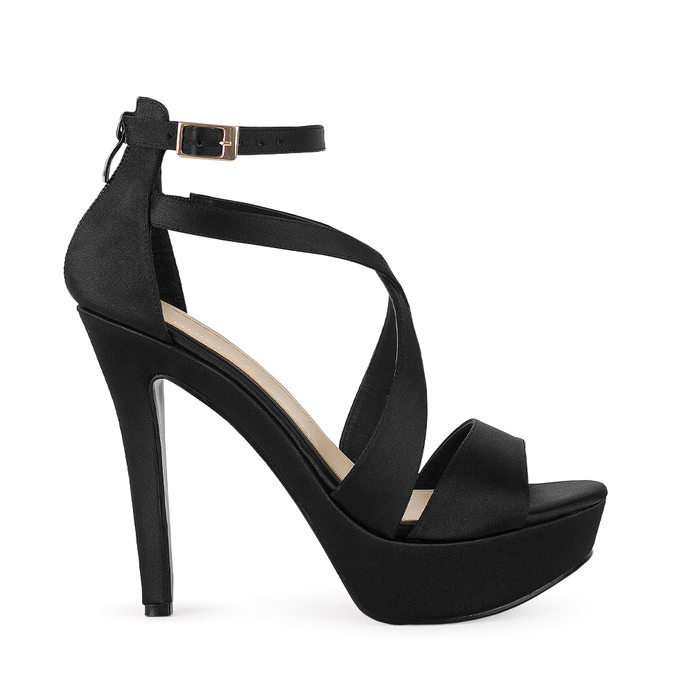 vista lateral de zapatilla negra con hebilla elegante para mujer