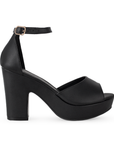 Vista lateral de zapatilla para mujer en color negro en acabado cabra sintético con pulsera y tacón ancho de 10cm