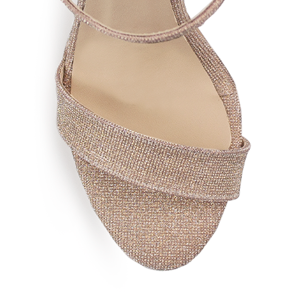 Vista del material sintético de zapatilla oro para mujer