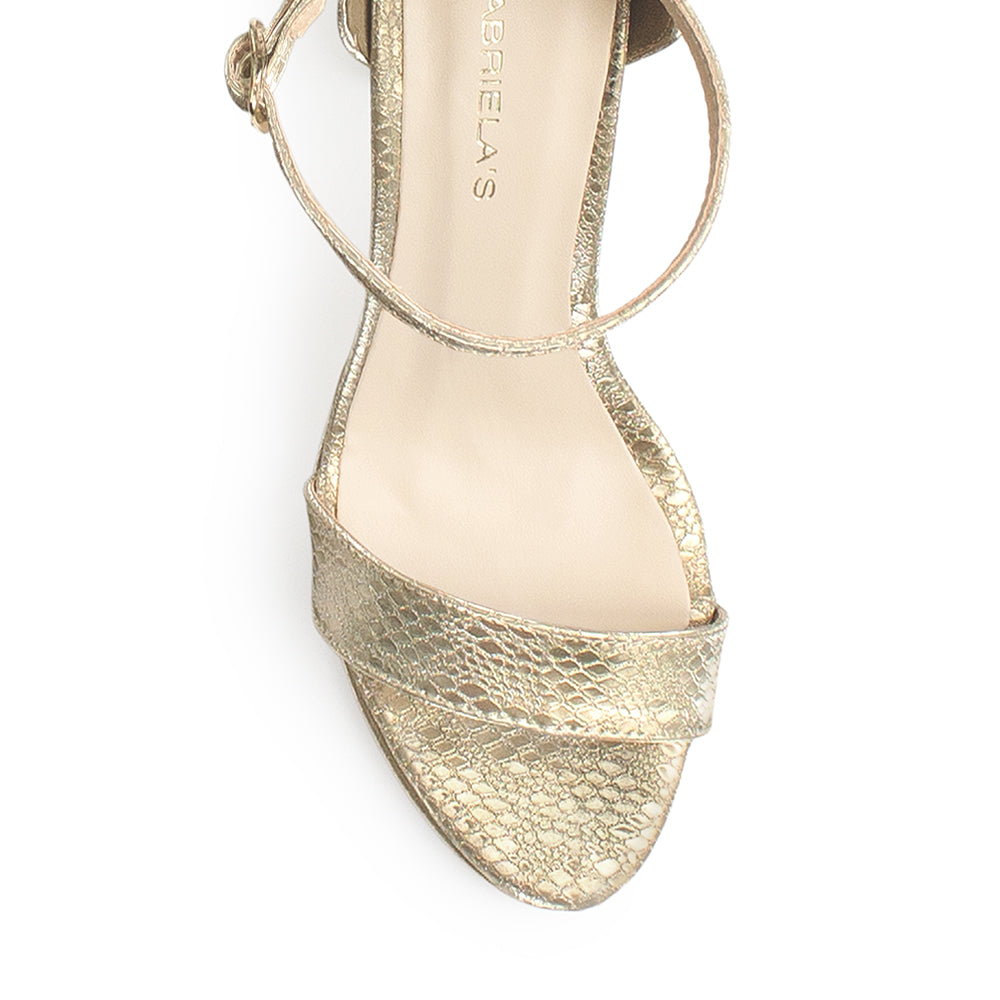 Vista del material sintético de zapatilla oro para mujer