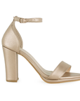 Vista lateral de zapatilla oro rosado con pulsera y tacón medio de 10cm para mujer