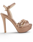 vista lateral de zapatillas oro rosa de dama con plataforma y tacón alto