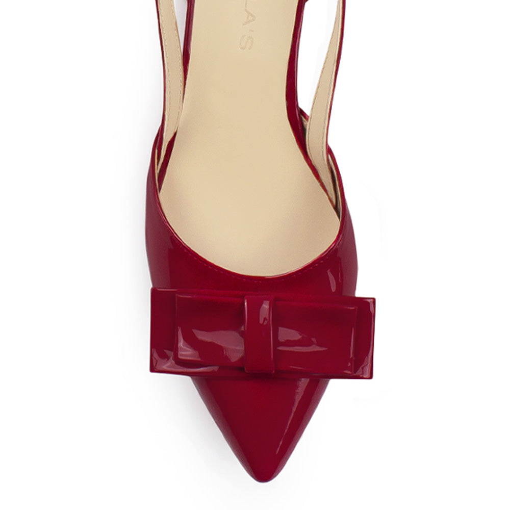 Vista de material charol en zapatilla para mujer con moño color rojo