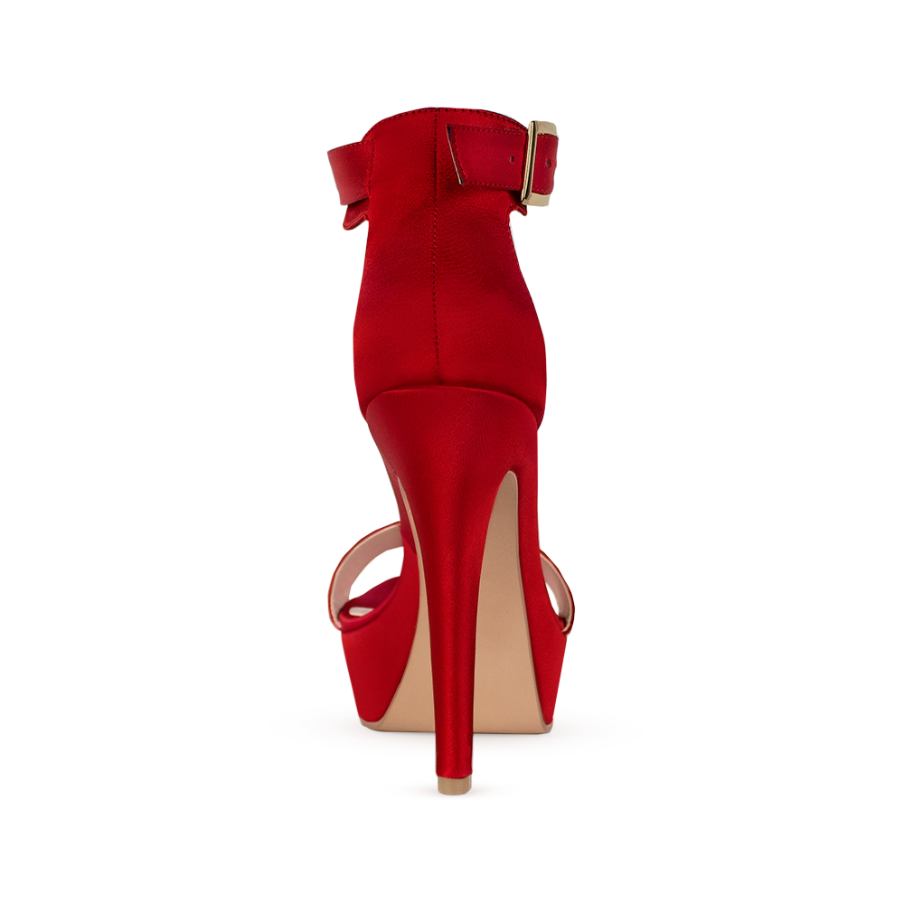 Vista trasera de zapatilla roja con tacon alto delgado para mujer