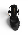 Vista superior de zapatillas negras con tacón medio y tiras para mujer